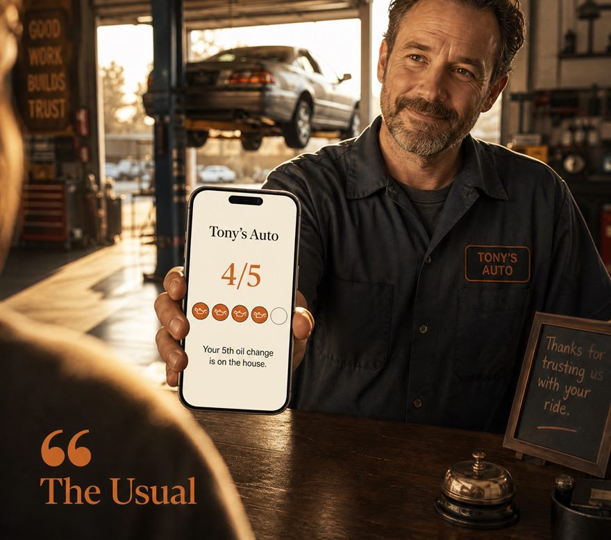 A mechanic at his shop counter showing a Tony's Auto loyalty card at 4 of 5 stamps