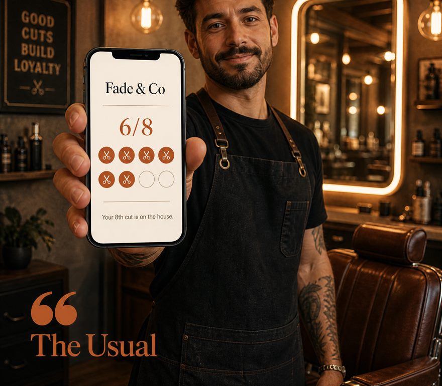 A barber holding a phone showing a Fade & Co loyalty card at 6 of 8 stamps
